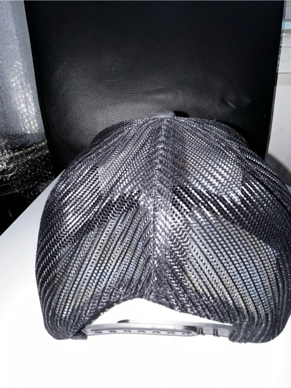 The Classic Black Snapback Hat with Orange and Blue Embroidered Logo